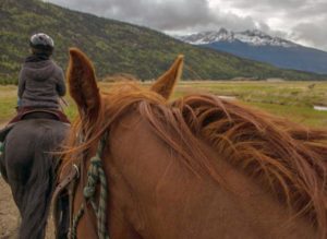 Horseback riders in Alaska.
